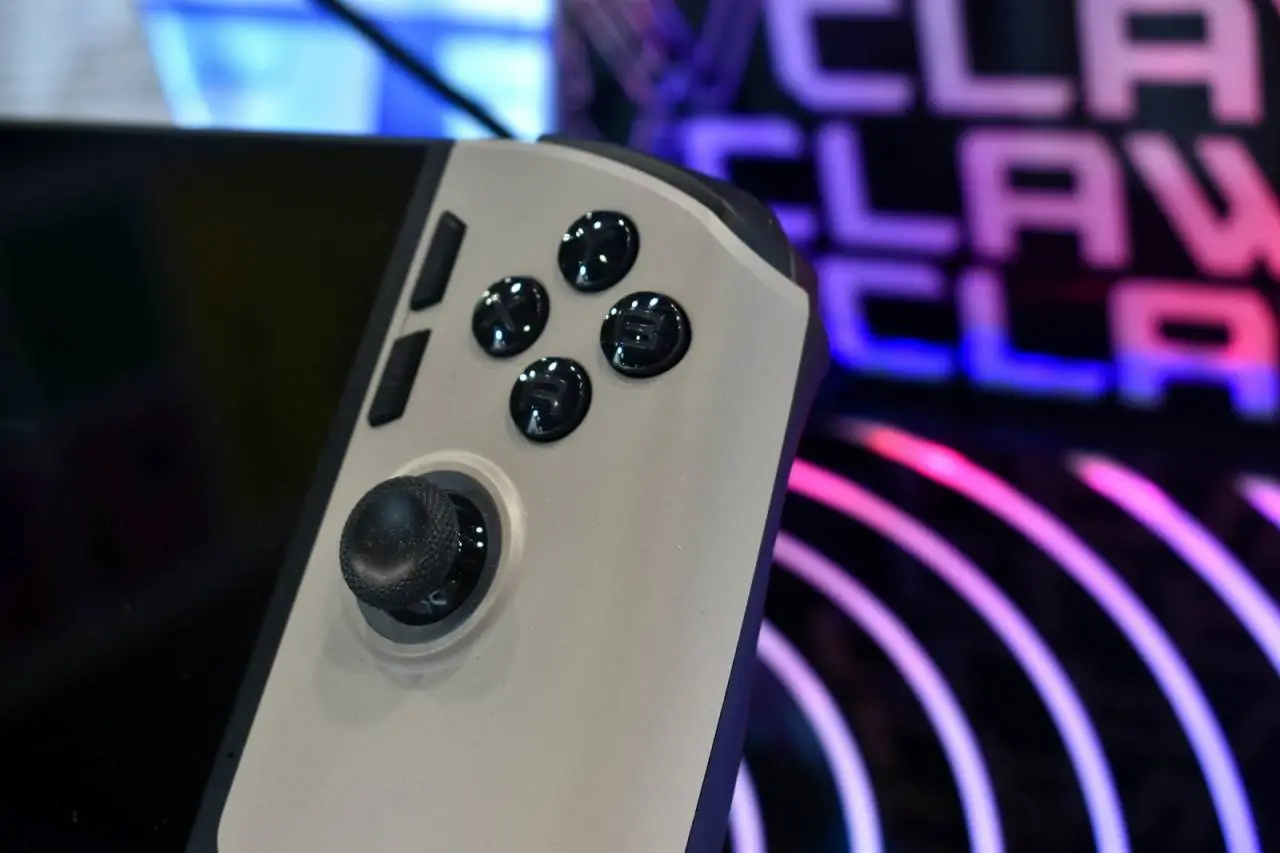 Close-up of a video game controller with colorful background