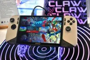 Handheld gaming device with colorful game display.