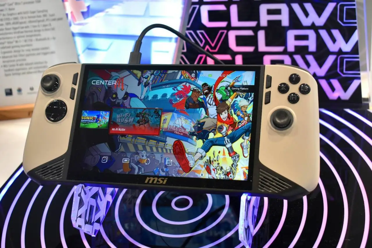 Handheld gaming device with colorful game display.